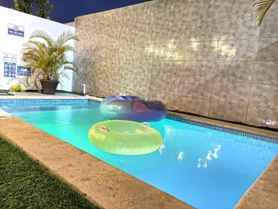 a swimming pool with two inflatables in a house at Townhouse with Private Pool and nearby beaches in Punta Cana