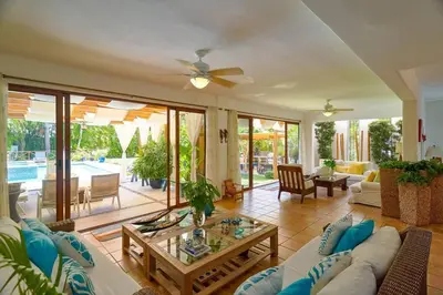 a living room with a couch and a table at Escape Beach Villa in El Portillo, Las Terrenas in Las Terrenas