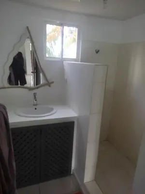 a bathroom with a sink and a mirror at Caoba in Las Terrenas