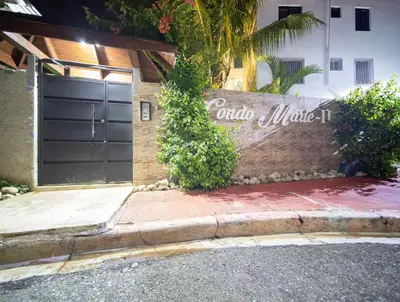 a garage with a sign on the side of a building at Stylish 1r-1b Apt Near The Beach And Main Street in Sosúa