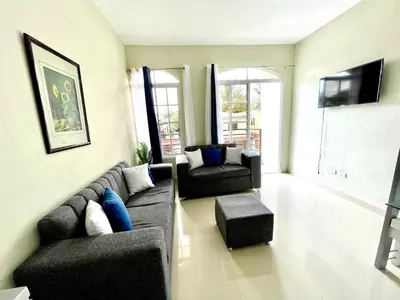 a living room with a couch and two chairs at Balcón Skyline 2 in Jarabacoa