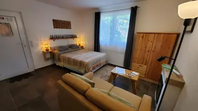 a living room with a bed and a couch at Apartamento los 3B in Manabao