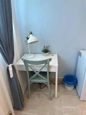 a desk with a lamp and a chair in a room at Noe Hotel One BedRoom #3 in Punta Cana