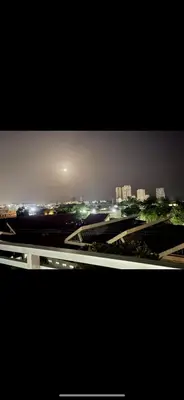 a view of a city at night with buildings at Super Luxurious L6 Sky Blue Apartment in Santo Domingo