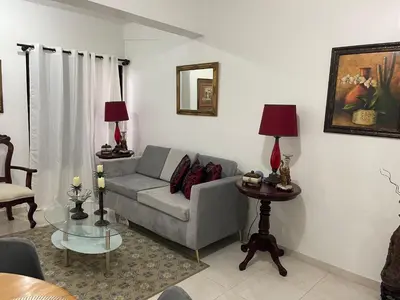a living room with a couch and a table at hospedaje de marant 2 in San Felipe de Puerto Plata