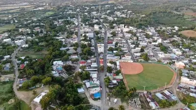 an aerial view of a city with a baseball field at Apartamentos ipap luperon in Puerto de Luperon