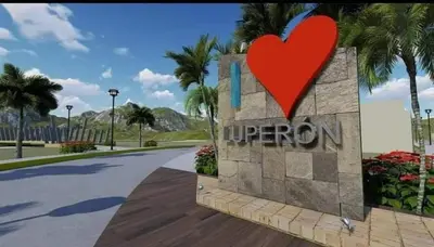a heart on a sign at the entrance to a resort at Apartamentos ipap luperon in Puerto de Luperon