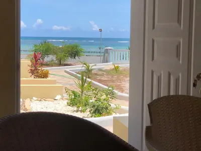 a view of the ocean from a room with a door at Punta Rucia Cristal Beach in Punta Rucia