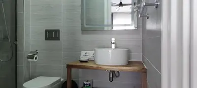 a bathroom with a sink and a toilet at Hotel El Quemaito - Luxury Oceanfront Retreat in Santa Cruz de Barahona
