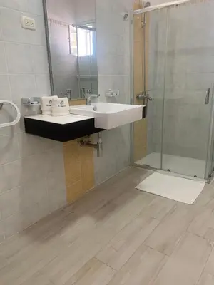 a bathroom with a sink and a shower at Hotel El Quemaito - Luxury Oceanfront Retreat in Santa Cruz de Barahona