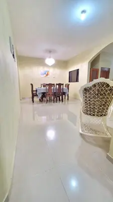 a living room with a table and chairs at Jarabacoa Mountain Views in Jarabacoa