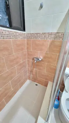 a bathroom with a shower with a toilet and a tub at Jarabacoa Mountain Views in Jarabacoa