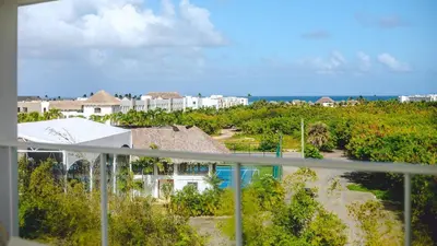 a balcony with a view of a resort at Hard Rock Area PH • Private Jacuzzi + Beach Views in Punta Cana