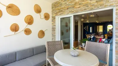 a dining room with a table and chairs at Luxury Condo with Golf Cart Included in Cana Pearl in Punta Cana