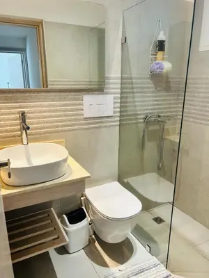 a bathroom with a toilet and a sink and a shower at My Dominicus Beach Retreat in Bayahibe