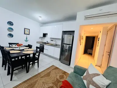 a kitchen and a dining room with a table and chairs at My Dominicus Beach Retreat in Bayahibe