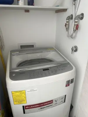 a washing machine sitting inside of a room at My Dominicus Beach Retreat in Bayahibe