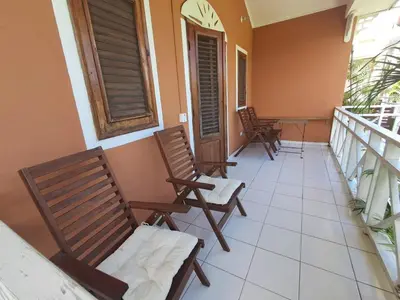 a balcony with chairs and a table on a balcony at Paradise Apartment with senic pool in beach area in El Callejón