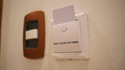 a switch on a wall with a sign on it at Hotel Blue Malecón And Spa in Santo Domingo
