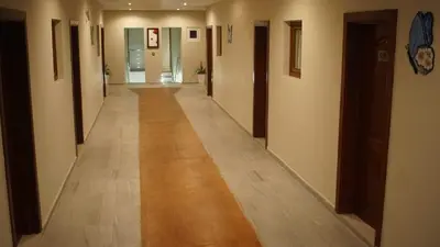 an empty hallway with a long hallway with a hallway at Hotel Blue Malecón And Spa in Santo Domingo