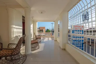 a room with chairs and a balcony with a view at Premium Single Room - Corales del Sur Ole Las Americas- Isabelita - Aeropuerto in La Viva