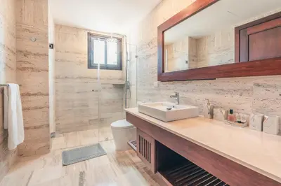 a bathroom with a sink and a mirror at Beautiful 2 BR apartment at Portillo in Las Terrenas