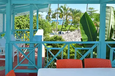 a view of the beach from the balcony of a house at B&B Aparthotel La Isleta in Las Galeras