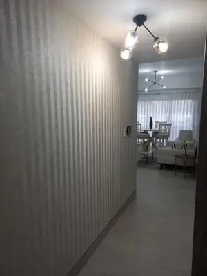 a hallway with a wall covered in white stripes at Brickell Hotel apto g 08 Santo Domingo Bella Vista in Santo Domingo