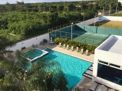an overhead view of a swimming pool in a building at Chic and Relax Apartamento Juan Dolio in San Pedro de Macorís