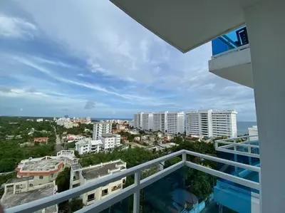 a balcony with a view of a city at Elegant Blue Sky View Lux at Juan Dolio Las Velas in Juan Pedro