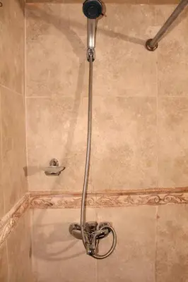 a shower with a shower head in a bathroom at Dominican Suite 12, Incredible 2 Bed Apt (DS12) in San Felipe de Puerto Plata