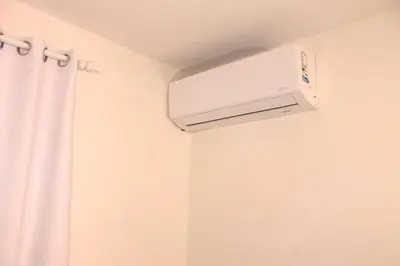 a bathroom with a air conditioner hanging from a ceiling at Dominican Suite 12, Incredible 2 Bed Apt (DS12) in San Felipe de Puerto Plata