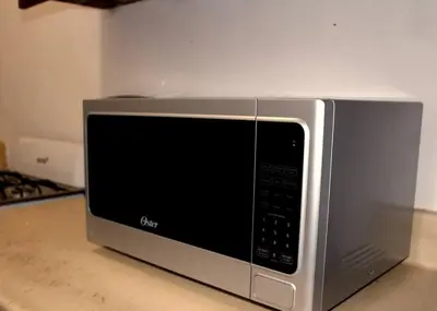 a microwave oven sitting on top of a counter at Dominican Suite 12, Incredible 2 Bed Apt (DS12) in San Felipe de Puerto Plata