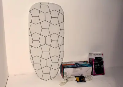 a snowboard leaned up against a wall next to a box at Dominican Suite 11, Amazing Apt/Studio (DS11) in San Felipe de Puerto Plata
