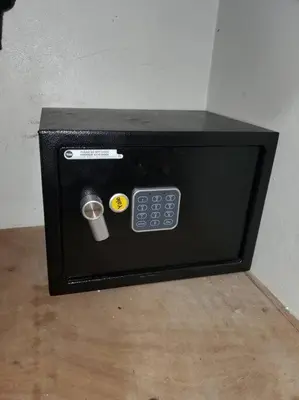 a black microwave with a remote control and a cup at Dominican Suite 23, Incredible 1 Bed Apt (DS23) in San Felipe de Puerto Plata