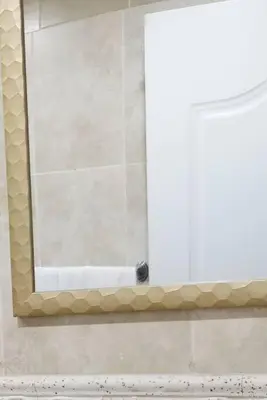 a mirror in a bathroom with a white door at Dominican Suite 23, Incredible 1 Bed Apt (DS23) in San Felipe de Puerto Plata