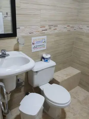 a bathroom with a toilet and a sink at Dominican Suite 1, Incredible Suite/Studio (DS1) in San Felipe de Puerto Plata