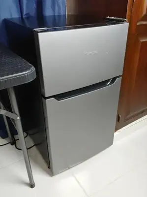 a white refrigerator next to a stool in a kitchen at Dominican Suite 1, Incredible Suite/Studio (DS1) in San Felipe de Puerto Plata
