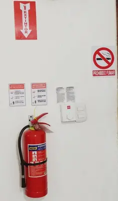 a red fire hydrant on a wall with signs at Dominican Suite 1, Incredible Suite/Studio (DS1) in San Felipe de Puerto Plata