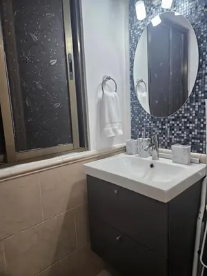 a bathroom with a sink and a mirror at Luxury apto 3 rooms+pool+ campo de golf. Cocotal in Punta Cana