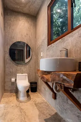 a bathroom with a sink and a toilet at El Valle Villas in Santa Bárbara de Samaná