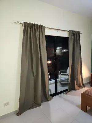 a curtain in a room with a window at Hotel La Casona MC in La Romana