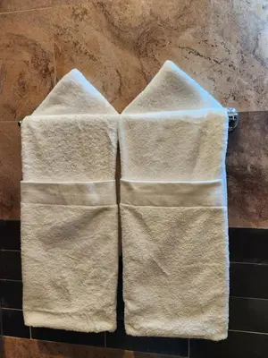 a pair of towels hanging on a wall at Hotel La Casona MC in La Romana