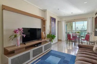 a living room with a large flat screen tv at VIP Exclusive One Bedroom Apartment in Santo Domingo