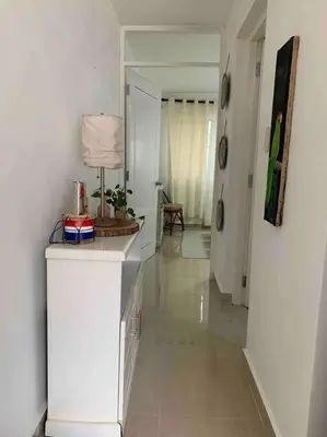 a room with a hallway with a lamp on a counter at Juan Dolio apart1 hab in Juan Pedro
