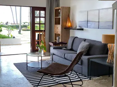 a living room with a couch and a table at CABARETE BEACH HOUSES the NANNY ESTATES in Cabarete