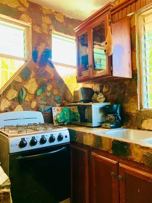 a kitchen with a stove and a counter top at Villa Marcia in Boca Chica