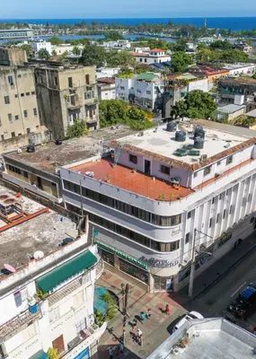 an overhead view of a city with a building at Hotel Libertad at historic main street in Santo Domingo
