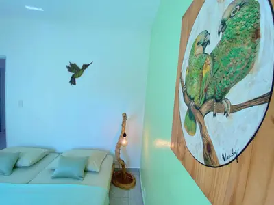 a room with a couch and a painting on the wall at Casa Blanca - White House in Cabarete