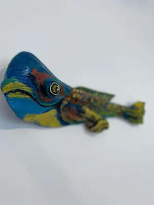 a colorful fish toy sitting on a white surface at Casa Blanca - White House in Cabarete